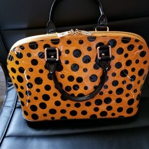 Genuine Leather Alma handbag.